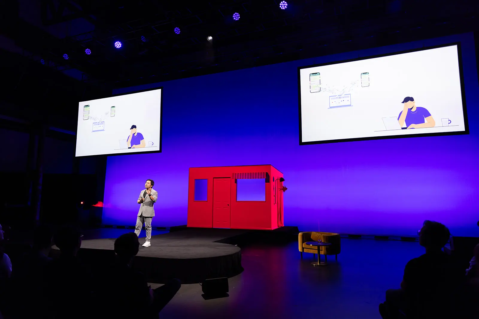 Anthony on stage presenting FlowGo's product slides at Startmate Demo Day
