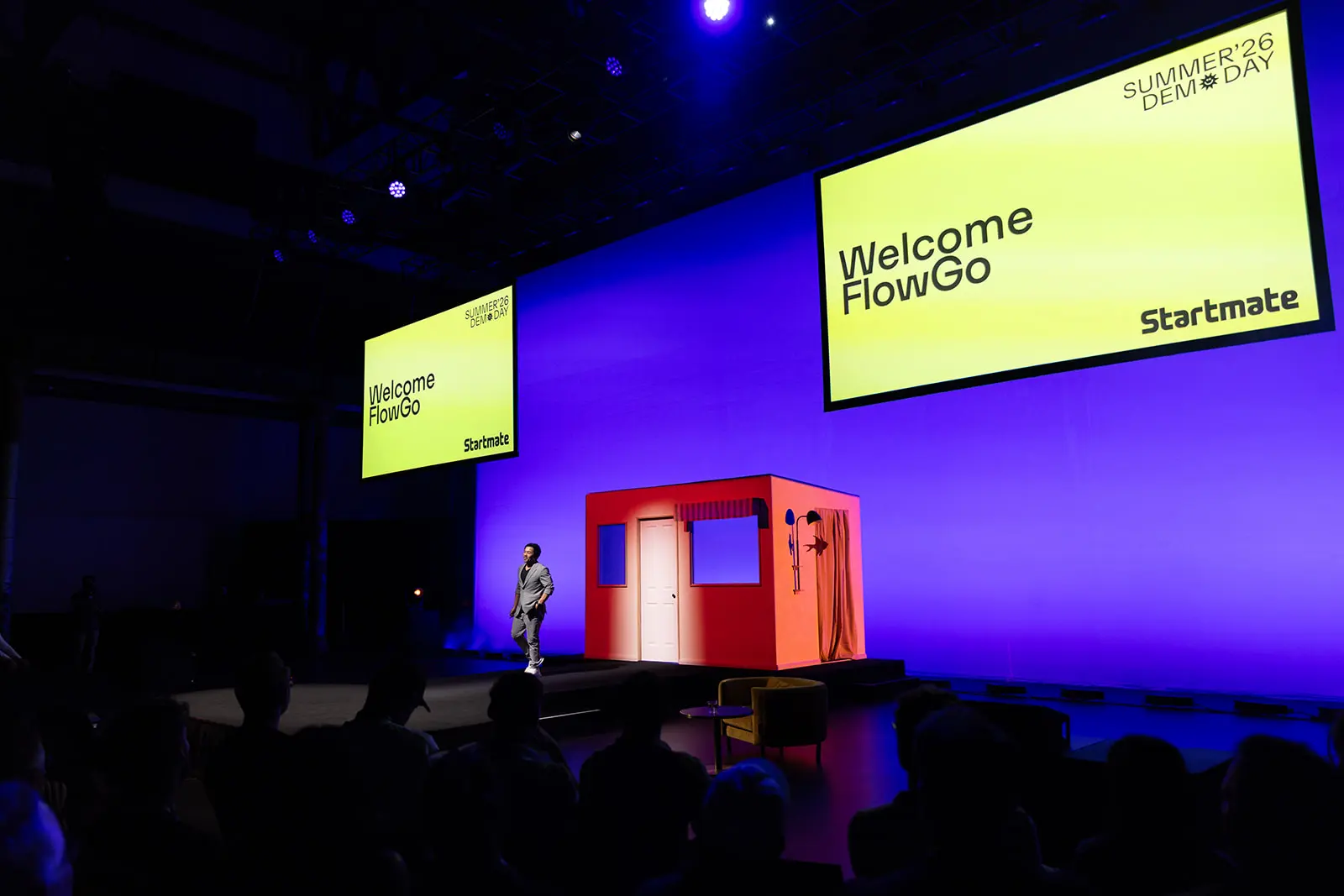 Startmate Summer '26 Demo Day stage with 'Welcome FlowGo' on the screens